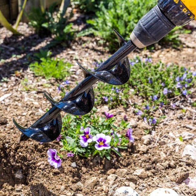 Power Planter auger bit attached to a drill.